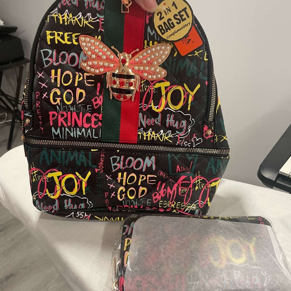 Graffiti Bag pack and wallet $55 each.